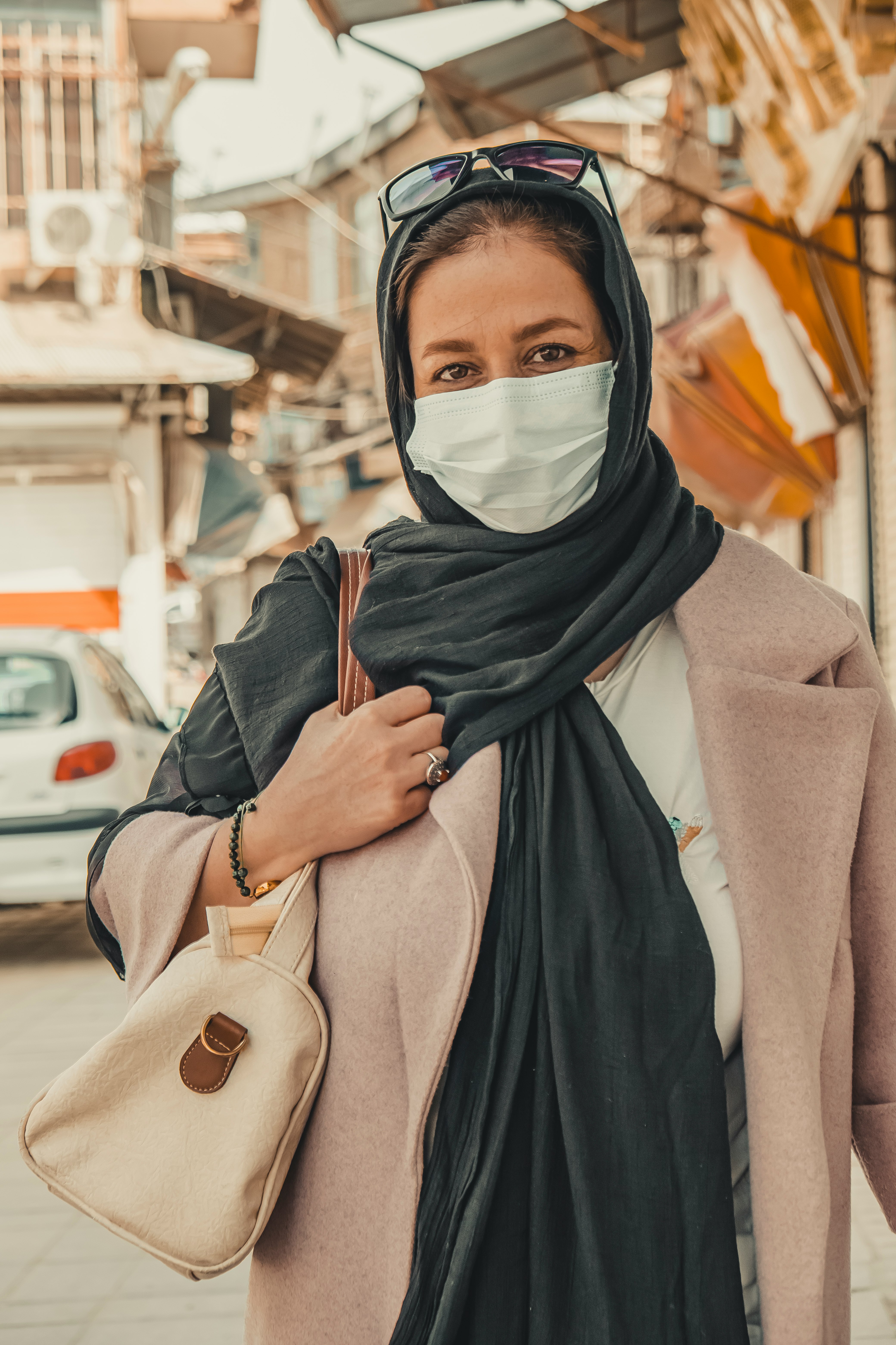 woman in black hijab and gray abaya